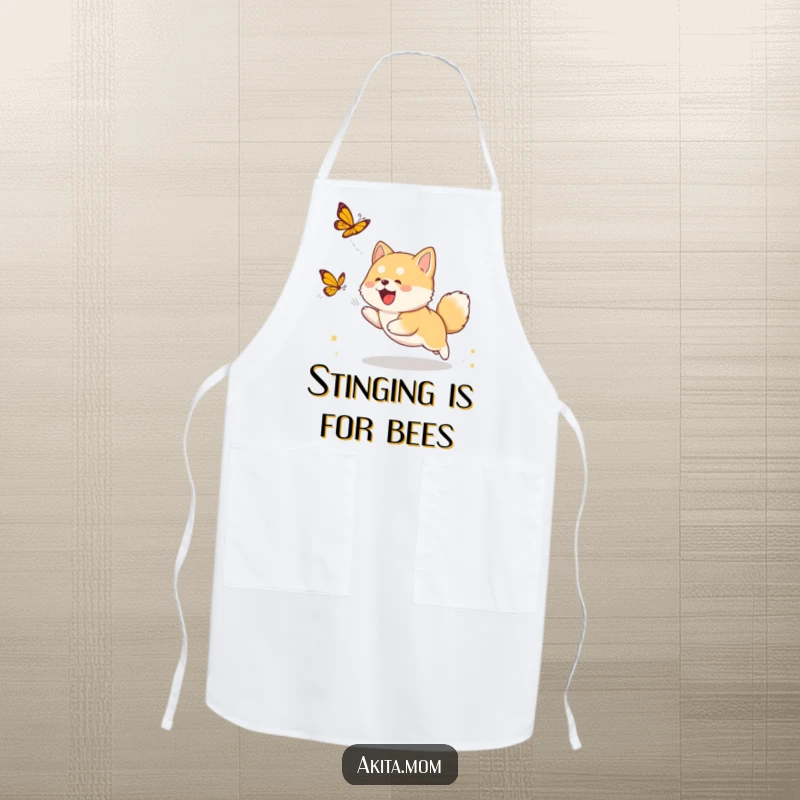 Funny Akita cub apron showing a cute puppy energetically chasing a butterfly, ideal for adding humor to cooking activities.