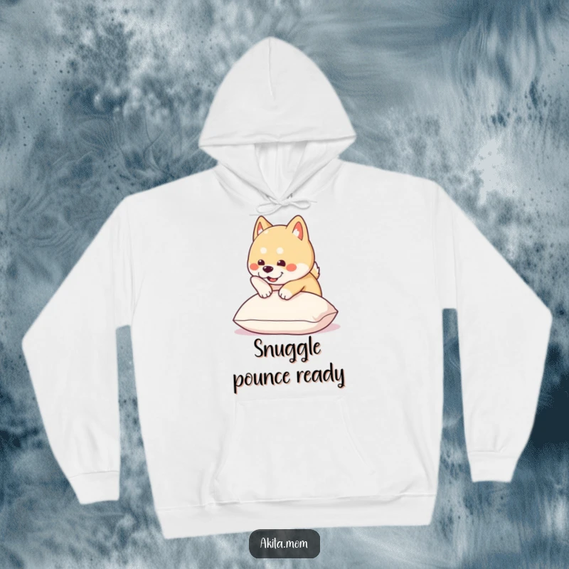Funny Kawaii Akita hoodie shows a cute dog about to pounce with playful energy onto a plush cushion, perfect for dog lovers.