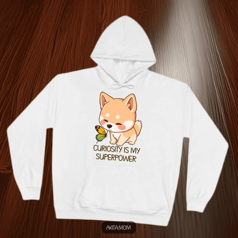 Funny Kawaii Akita dog hoodie, showing a curious sniff at a butterfly, offering warmth and a touch of gentle, whimsical humor.