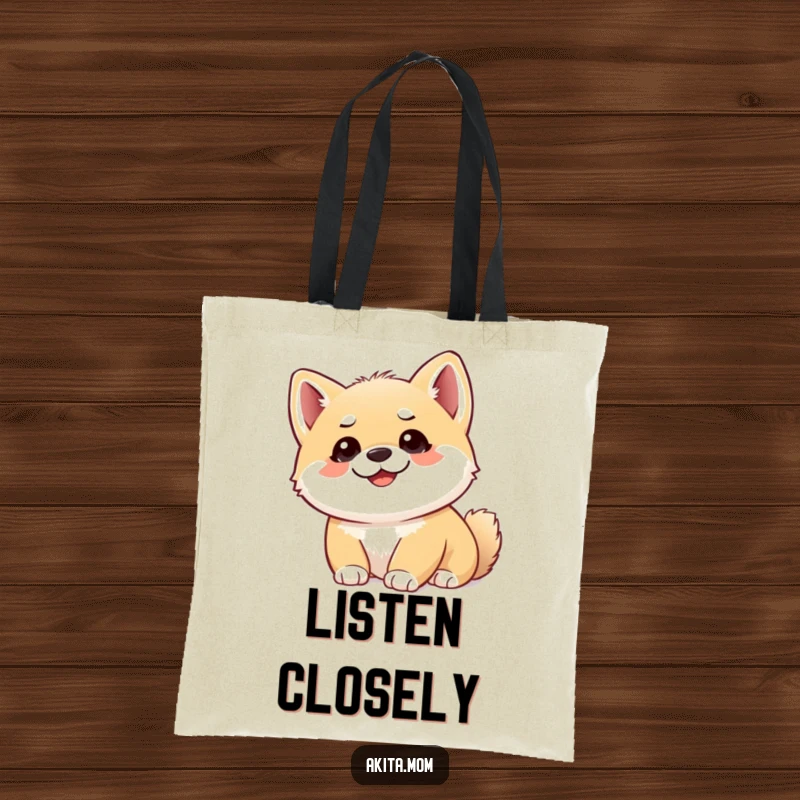 Funny Akita cub tote bag with a cute puppy looking upwards with alert ears, offering a humorous and practical accessory.
